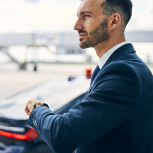 Elegant Man Lifting His Left Hand To Check The Time