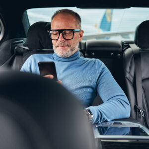 Taxi Passenger Sitting In The Back Seat