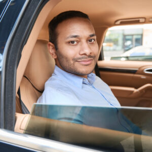 Contented Male Passenger Seated In Motor Vehicle