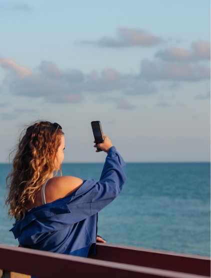 Girl Takes Pictures Of The Sea Vacations