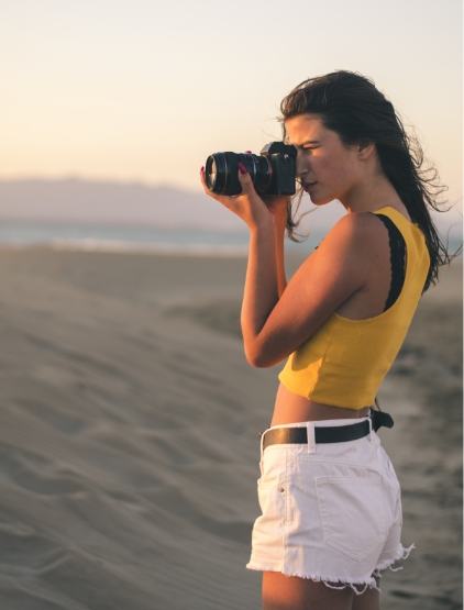 Teenage Girl Taking Photos With Camera On The Beach Holidays Traveler